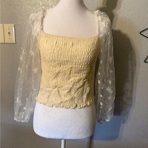 Elegant Yellow Smocked Top with Sheer Star Sleeves